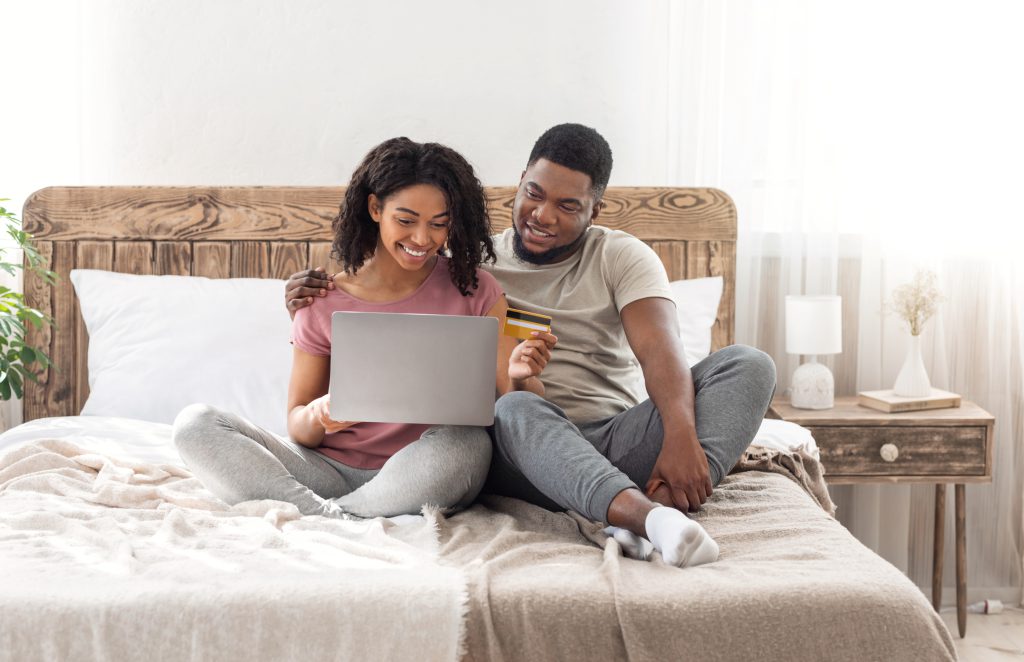Happy man and woman buying stuff online