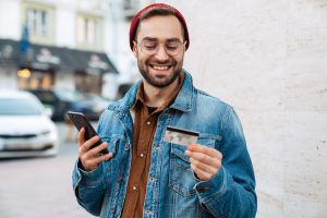 happy man with credit card